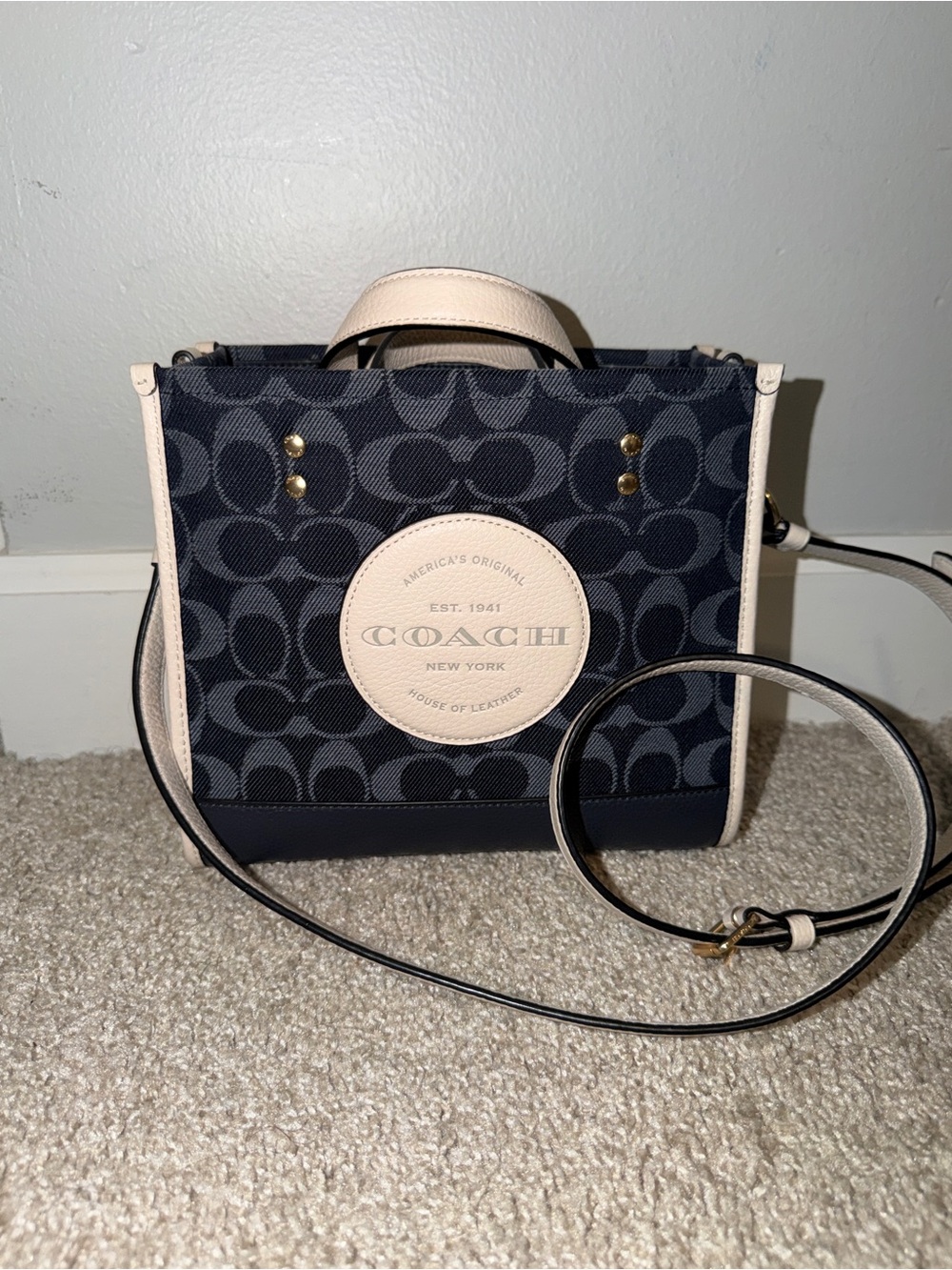 Coach Dempsey Tote 22 — Navy Signature Jacquard / Cream-Chalk trim
+ Coach Snap